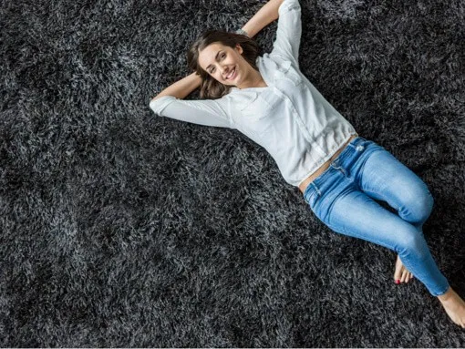 Lady chilling on floor | Goetze Bros. Carpet & Furniture